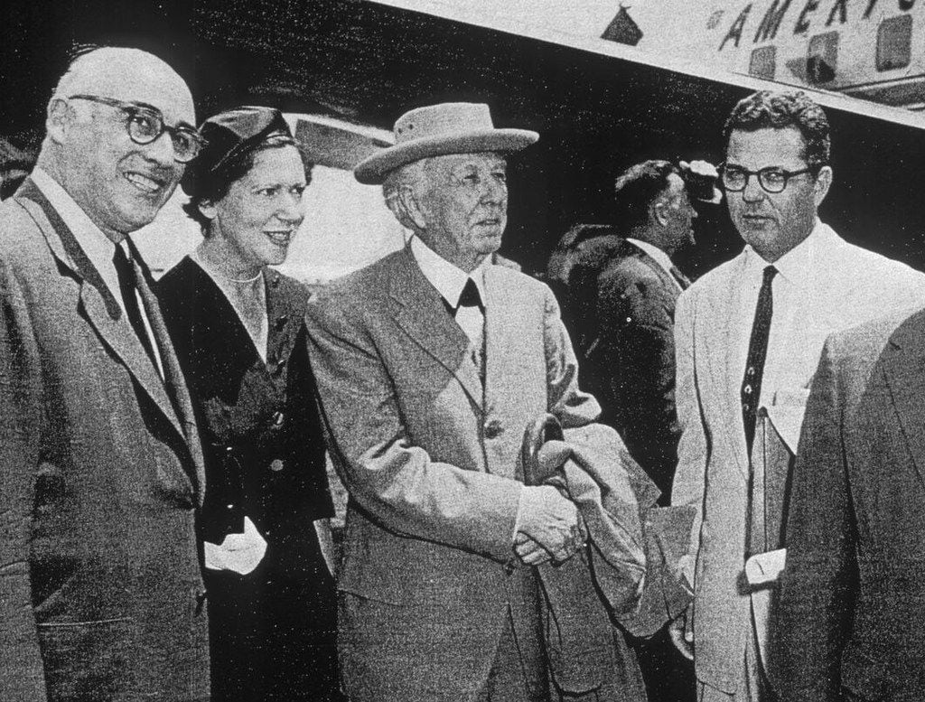 Robert Stecker (left), president Dallas Theater Center Board, with Kalita Humphreys Theater architect Frank Lloyd Wright (center) and Paul Baker, director of the Dallas Theater Center, upon Wright's arrival at Love Field. Undated.
