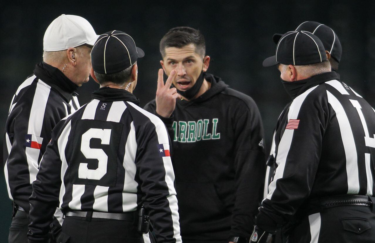 Southlake Carroll head coach Riley Dodge draws the attention of game officials at halftime...