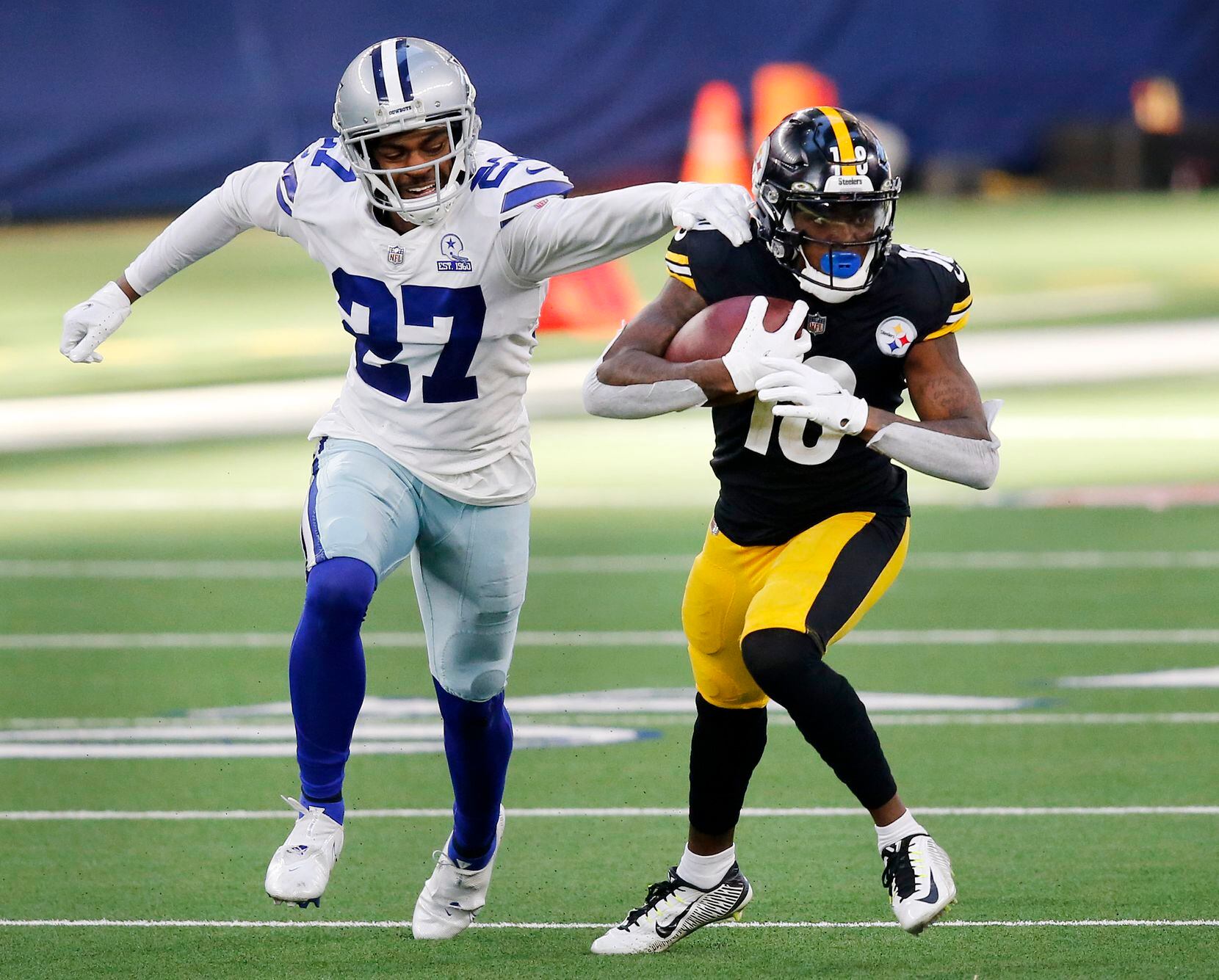 Dallas Cowboys cornerback Trevon Diggs (27) misses a tackle of Pittsburgh Steelers wide receiver Diontae Johnson (18) during the second quarter at AT&T Stadium in Arlington, Texas Sunday, November 8, 2020. (Tom Fox/The Dallas Morning News)