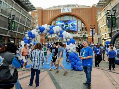 Dallas Mavericks fans gather outside before the Mavs home opener at the American Airlines...