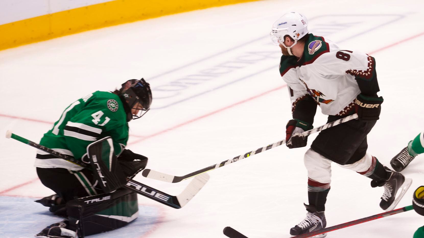 Dallas Stars goaltender Scott Wedgewood (41) stops a goal by Arizona Coyotes right wing Phil...