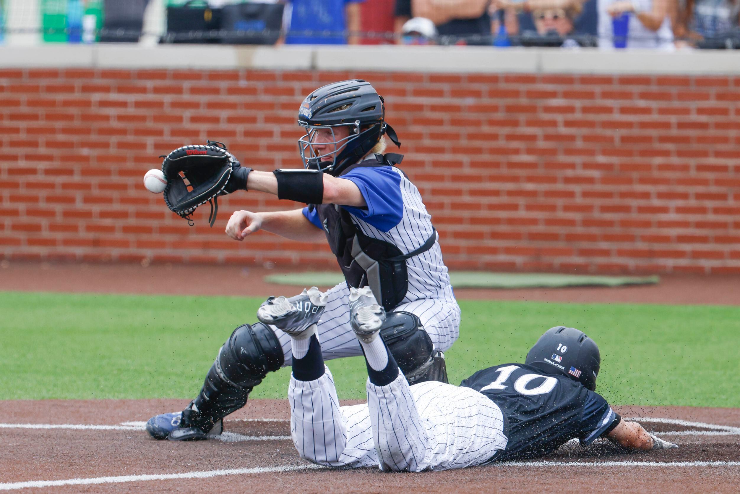 Byron Nelson High School catcher Carson Packan (back) misses to catch as Denton Guyer’s...
