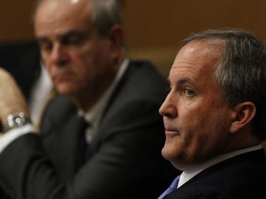 Texas Attorney General Ken Paxton, right, looks at one of the special prosecutors during a pre-trial motion hearing for his securities fraud case at the Collin County Courthouse on Tuesday, Dec. 1, 2015, in McKinney, Texas.. (Jae S. Lee/Staff Photographer)