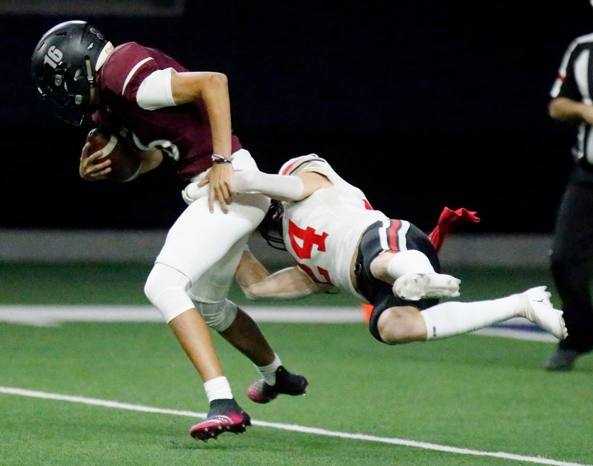 Lovejoy High School defensive back Trent Rucker (24) brings down Mansfield Timberview High...