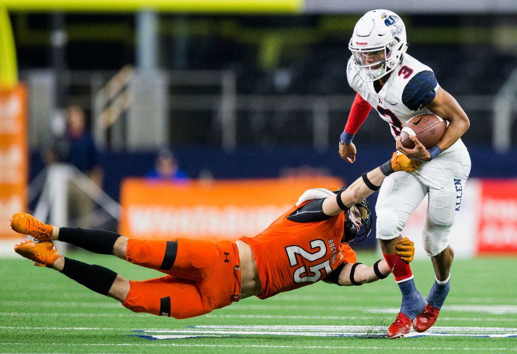 Allen quarterback Raylen Sharpe (3) is tackled by Rockwall defensive back Corey Kelley (25) during the fourth quarter of a Class 6A Division I area-round high school football playoff game between Allen and Rockwall on Friday, November 22, 2019 at AT&T Stadium in Arlington. (Ashley Landis/The Dallas Morning News)