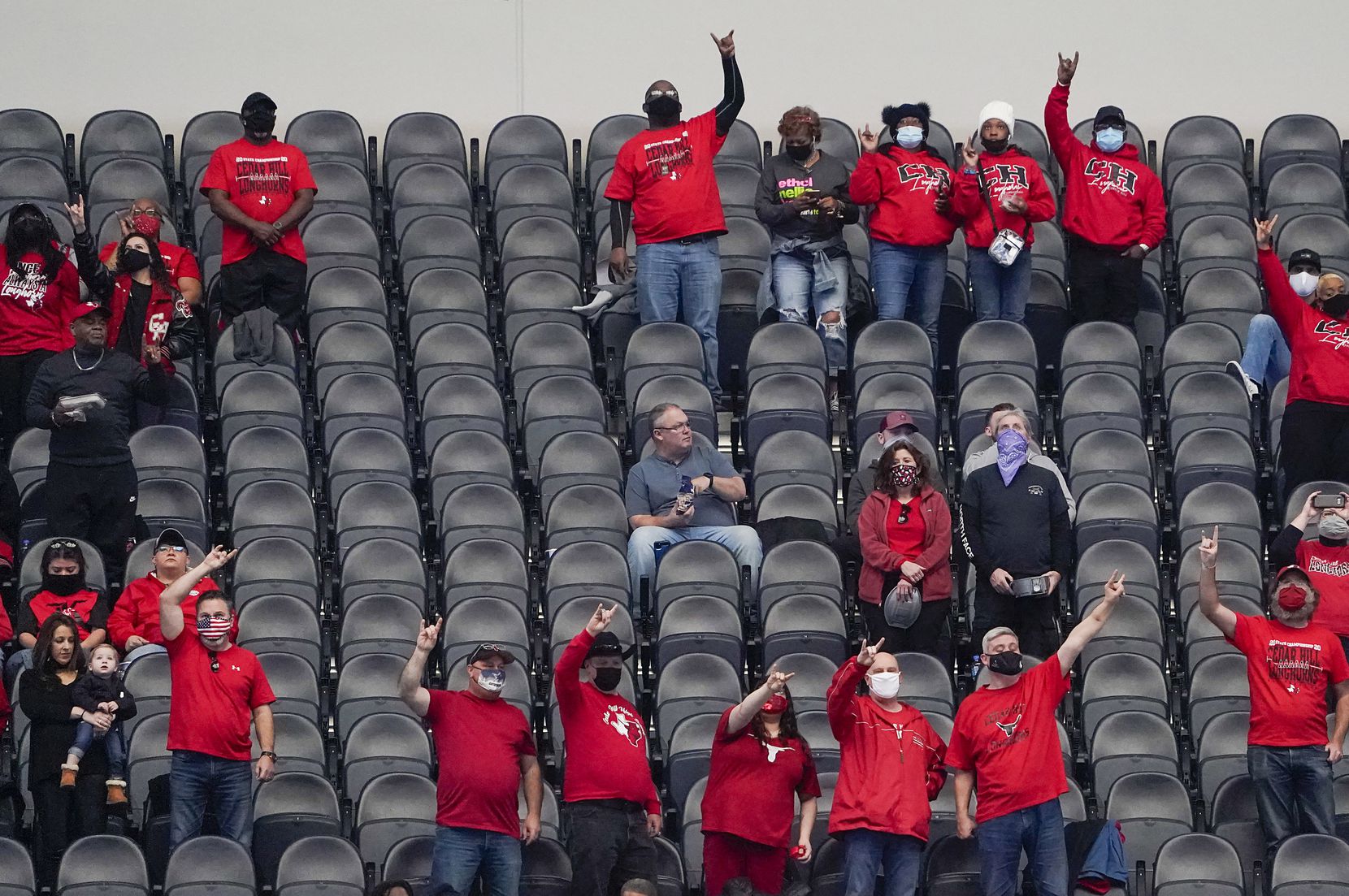 Cedar Hill fans stand for their school song before the Class 6A Division II state football championship game against Katy at AT&T Stadium on Saturday, Jan. 16, 2021, in Arlington, Texas.