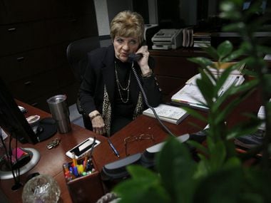 Marylyn Love, longtime secretary for Dallas Cowboys owner Jerry Jones, takes a phone call at...