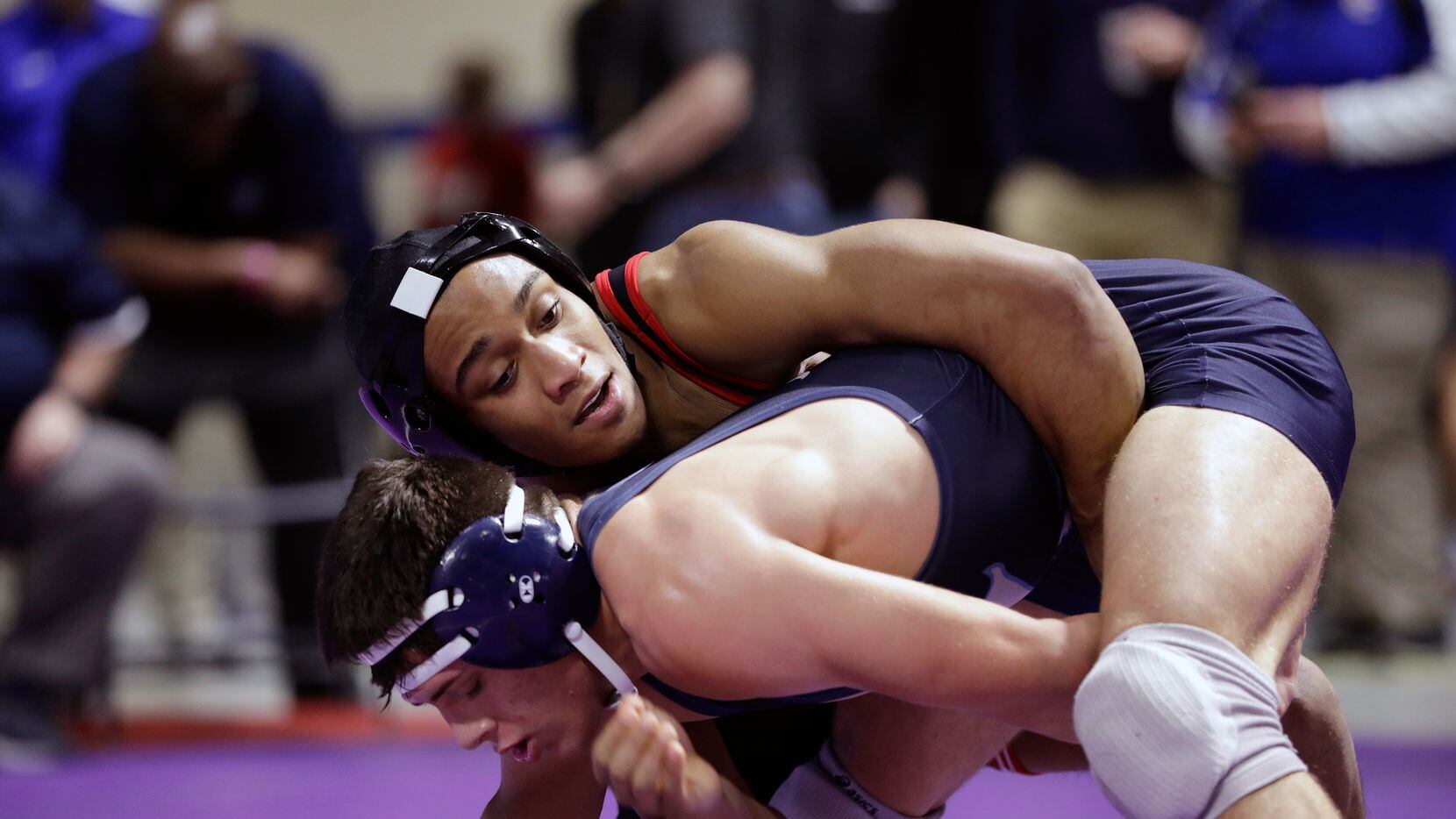 Elise Brown Ton of Allen wrestles during the UIL Texas State Wrestling Championships,...