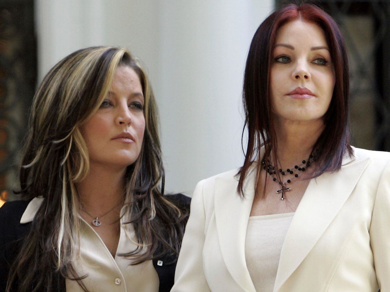 FILE - Lisa Marie Presley, left, and her mother Priscilla Presley await the arrival of...