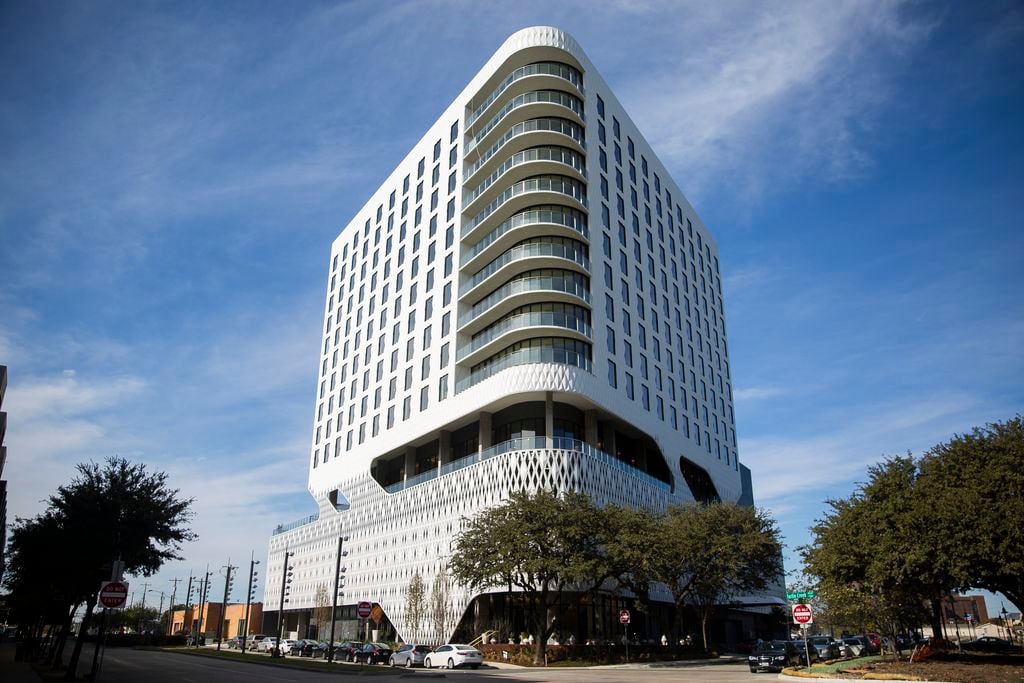 The Virgin Hotels Dallas has a diamond-patterned skin exterior on the lower levels. The...