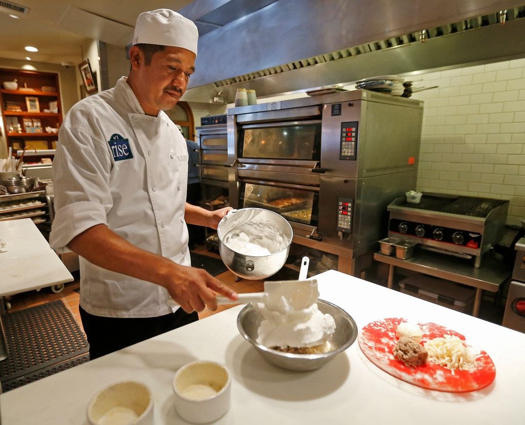 Chef Alberto Solis prepares duck souffles at Rise restaurant in Dallas.