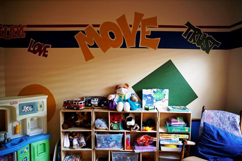 Stuffed animals, toys and board games are found in a room used for treatment and therapy at...