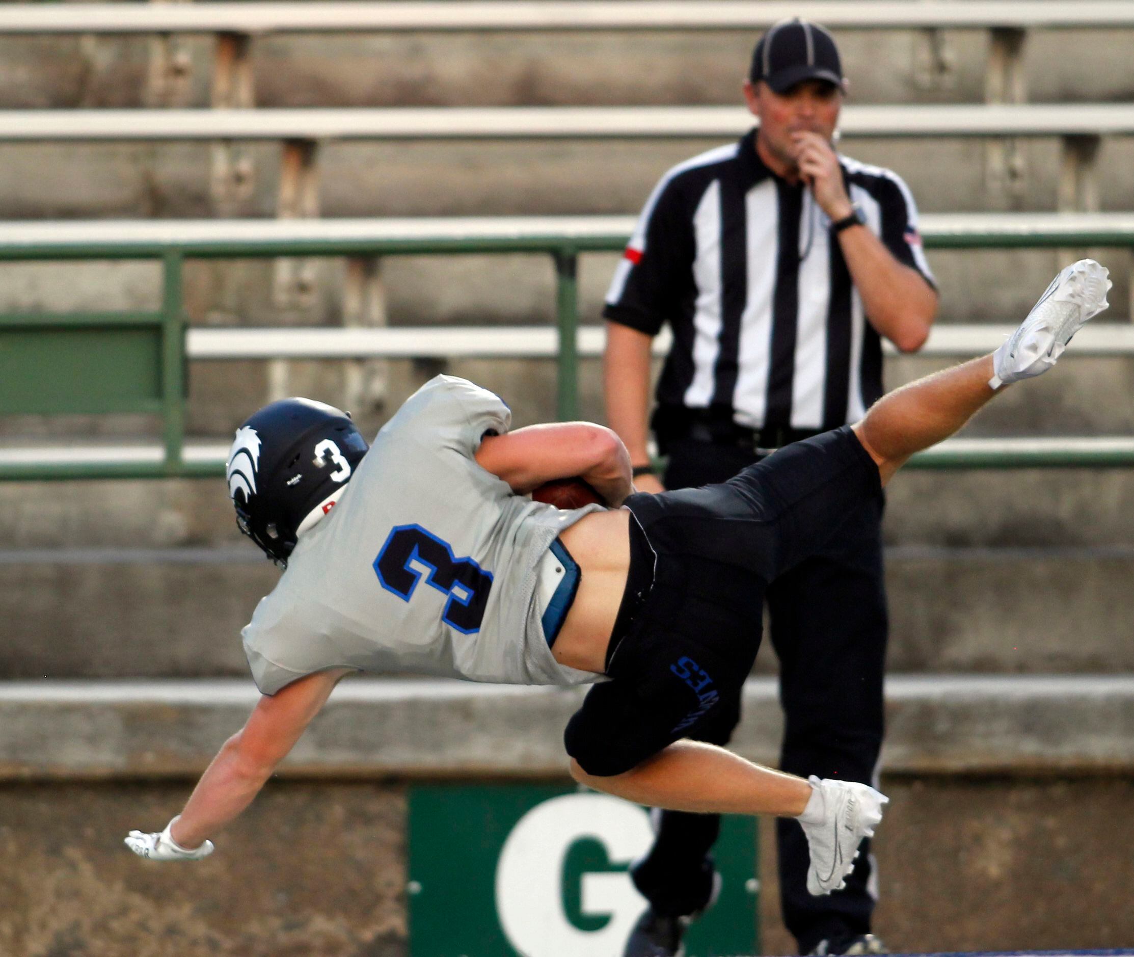 Plano West receiver Charlie Johnson (3) dives into the end zone for a first quarter...