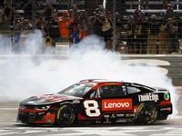 Tyler Reddick burns his tires after winning the the NASCAR Cup Series auto race at Texas...