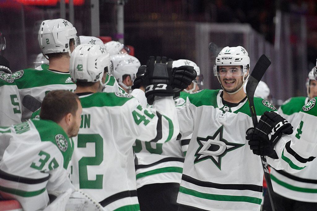 Dallas Stars right wing Nick Caamano, right, celebrates his goal during the third period of the team's NHL hockey game against the Washington Capitals, Tuesday, Oct. 8, 2019, in Washington. The Stars won 4-3 in overtime. (AP Photo/Nick Wass)