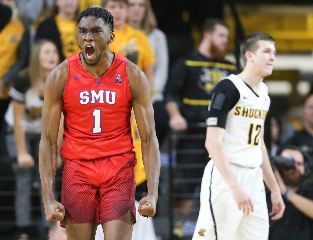 Southern Methodist's Shake Milton (1) celebrates a basket and a foul during the second half...