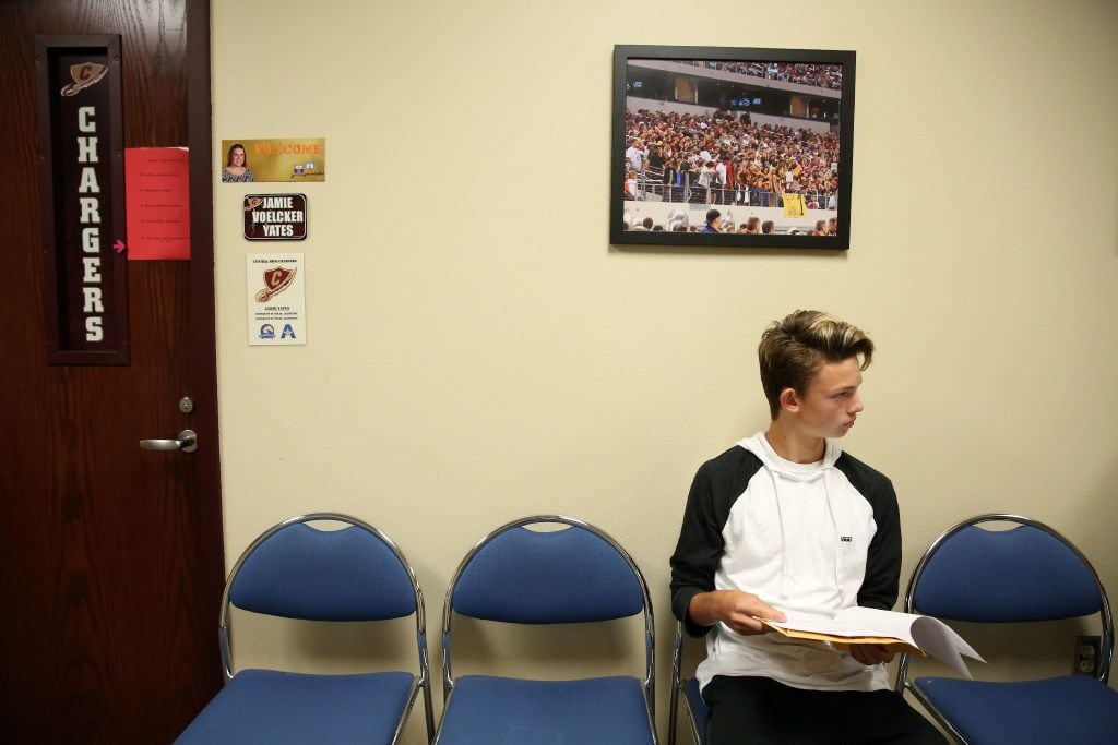 Marshall Dickson, a sophomore soccer player at Central High School, waits to get a ECG test...