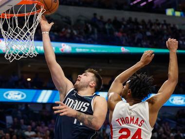 Dallas Mavericks guard Luka Doncic (77) attempts a layup against Brooklyn Nets guard Cam...