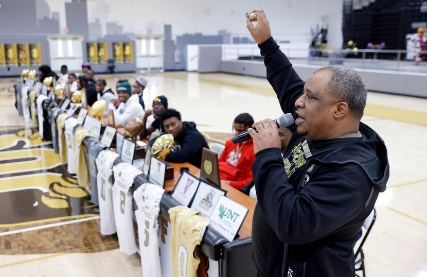 South Oak Cliff head football coach Jason Todd raises the two State Championship rings as he...