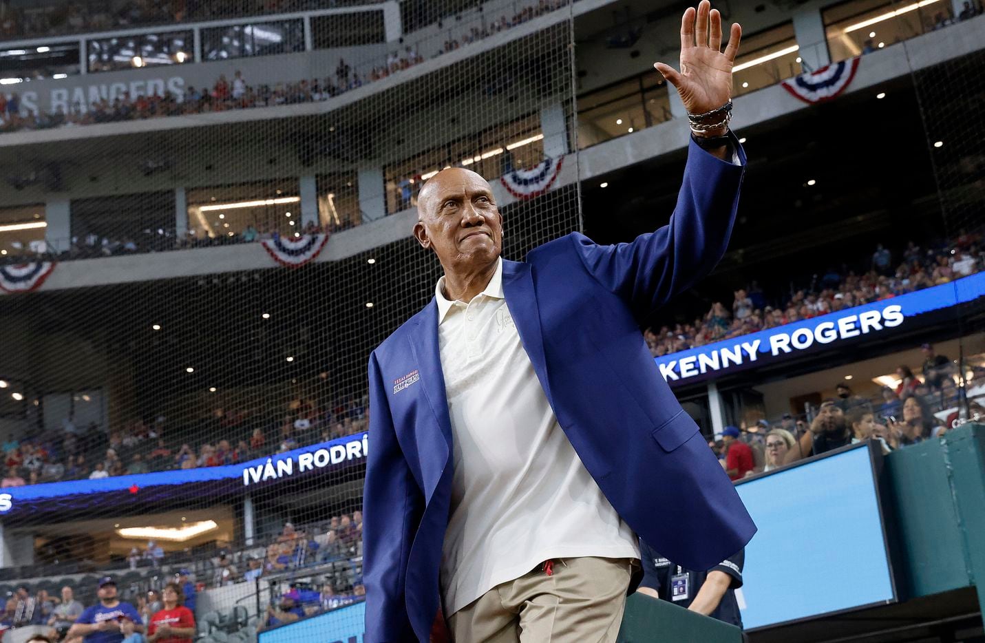 Texas Rangers Baseball Hall of Fame member Ferguson Jenkins waves to the crowd as he's introduced before the induction ceremony for Adrian Beltre and Chuck Morgan at Globe Life Field in Arlington, Saturday, August 14, 2021.(Tom Fox/The Dallas Morning News)