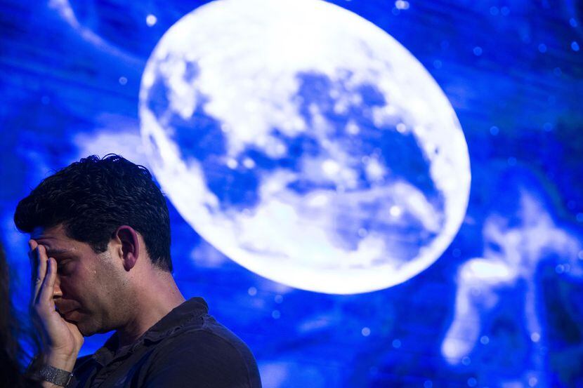 A man in Tel Aviv reacts after an Israeli spacecraft failed to land safely on the moon on...