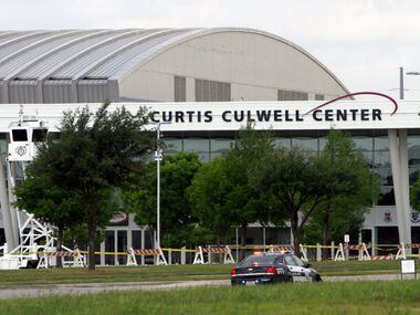 A Garland Police car is parked outside of the Curtis Culwell Center after a shooting...