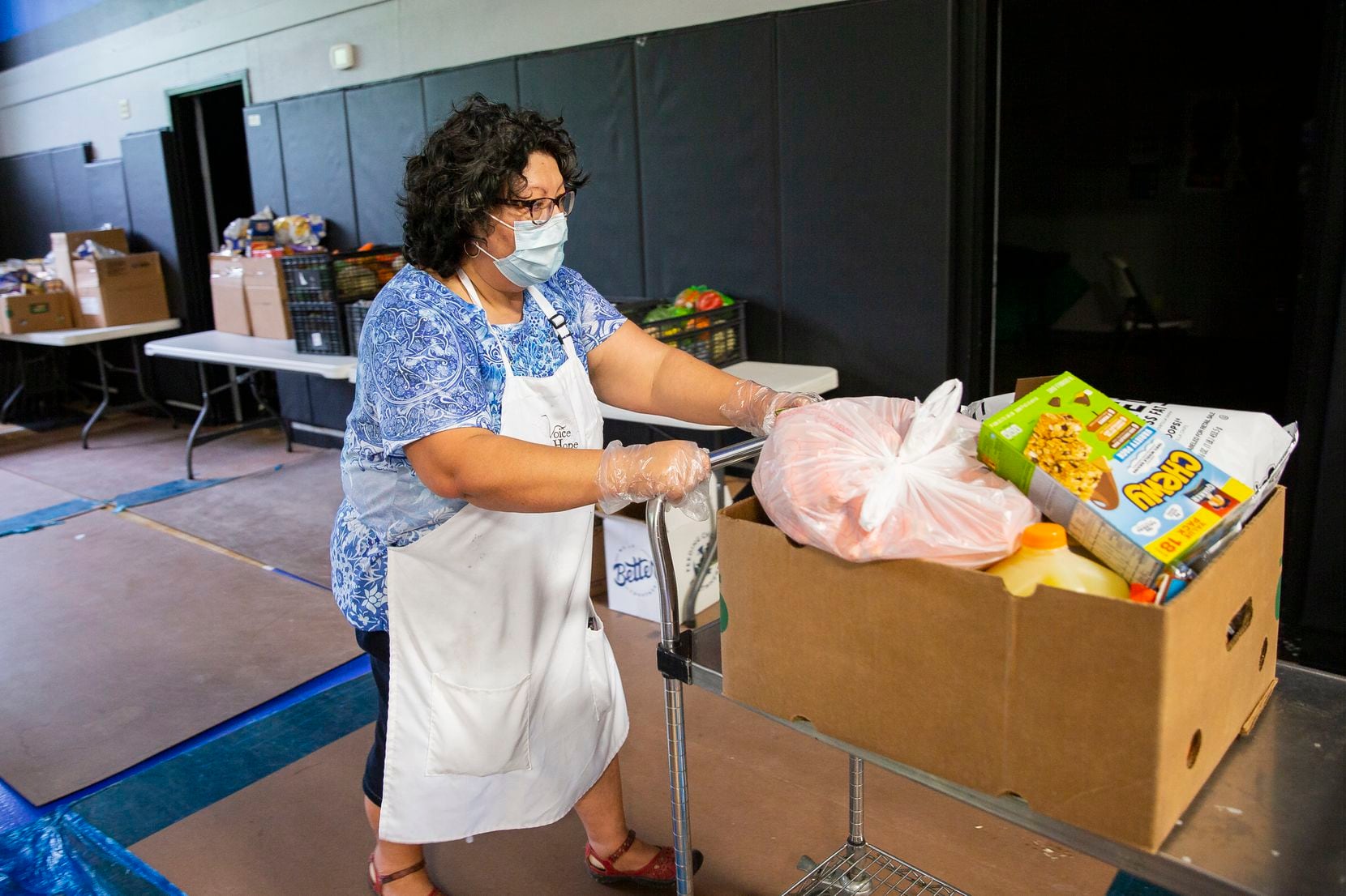 Debbie Orozco Solis works at the Voice of Hope food pantry in West Dallas. She is determined...