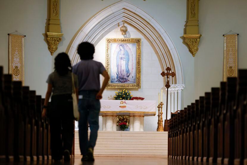 A photo of Our Lady of Guadalupe hangs above the altar as parishioners enter the National...