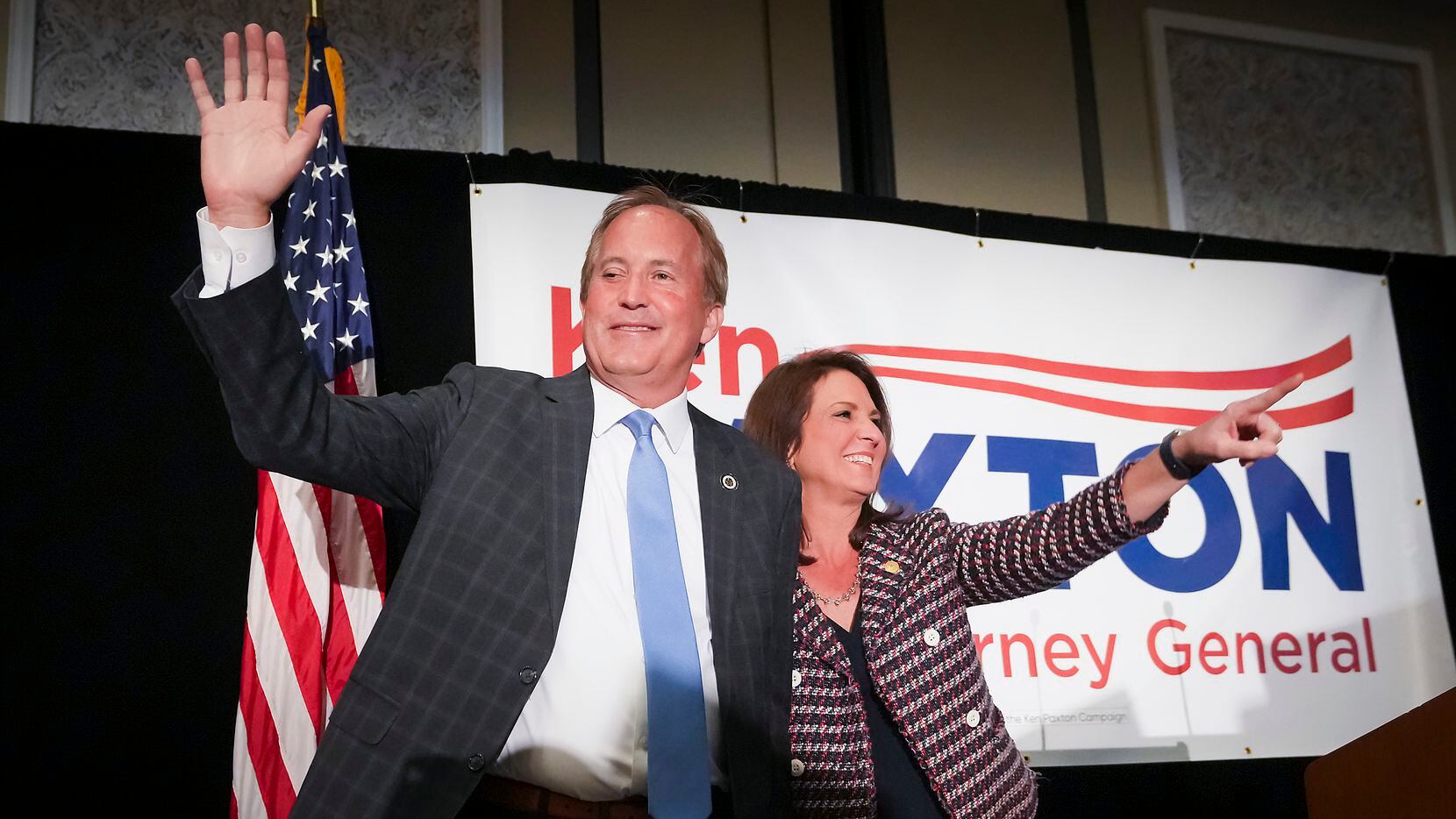 Texas Attorney General Ken Paxton waves to supporters with his wife, State Sen. Angela...