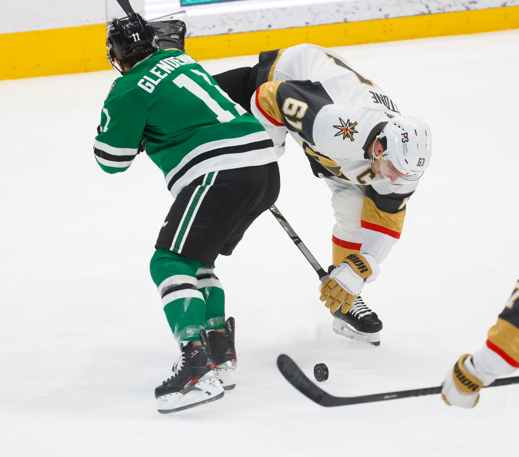 Vegas Golden Knights right wing Mark Stone (61) follows the puck behind Dallas Stars center...
