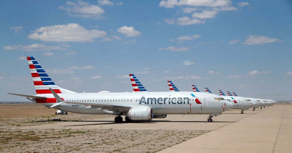 Eight of about a dozen grounded American Airlines Boeing 737 Max 8 aircraft are parked on a remote taxiway at Roswell International Air Center in Roswell, New Mexico.