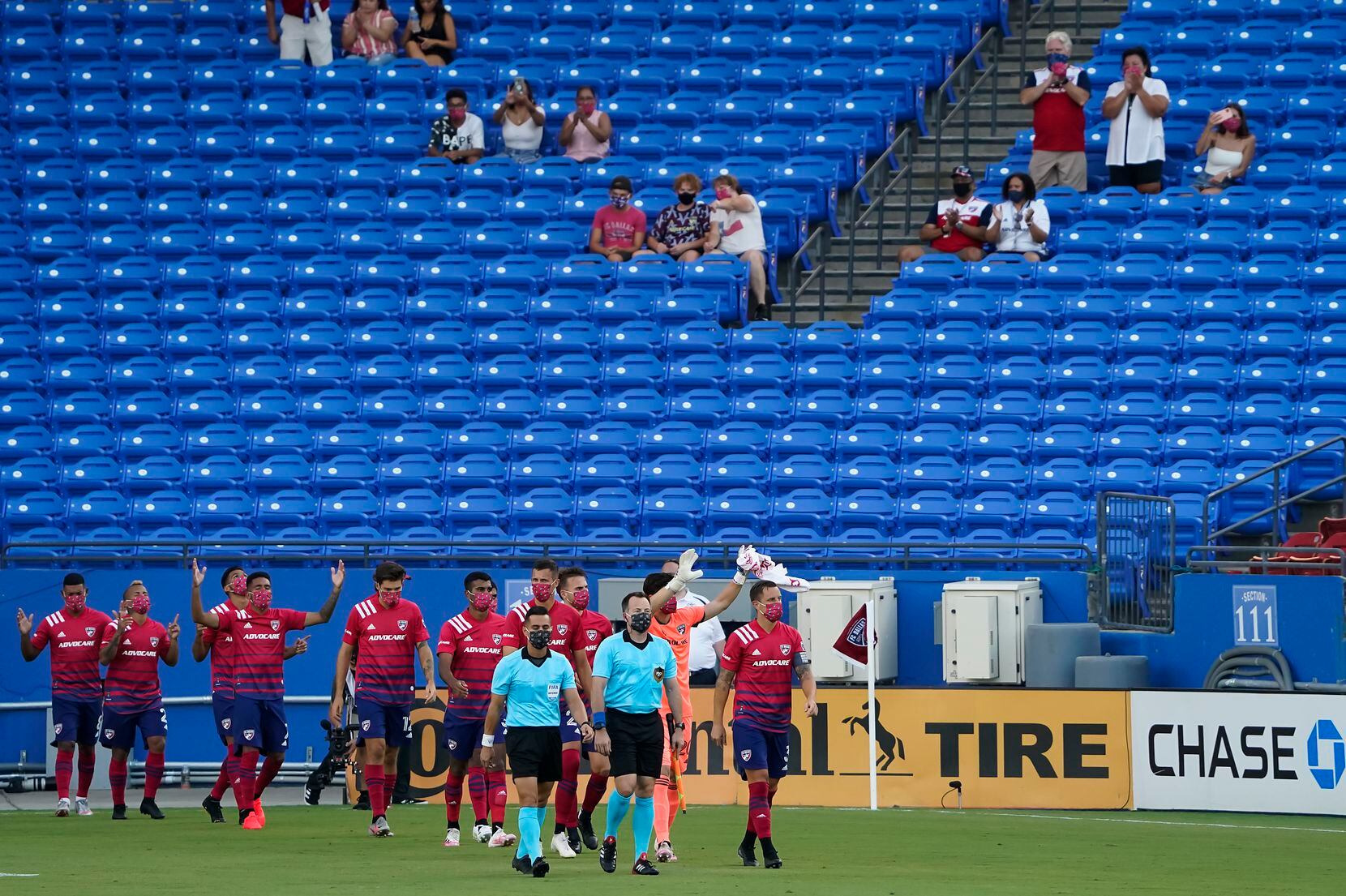FC Dallas player acknowledge supporters as they take the field before an MLS soccer game against the Nashville SC at Toyota Stadium on Wednesday, Aug. 12, 2020, in Frisco, Texas. (Smiley N. Pool/The Dallas Morning News)