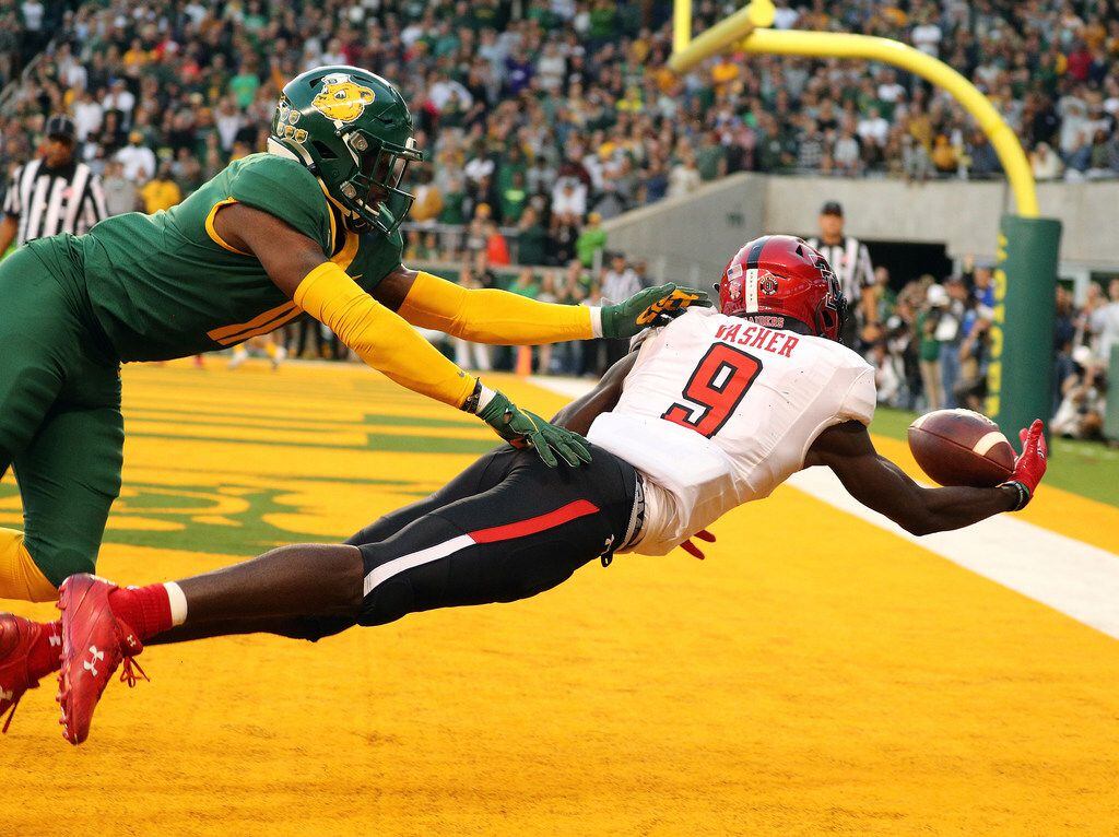 WACO, TEXAS - OCTOBER 12: T.J. Vasher #9 of the Texas Tech Red Raiders makes a touchdown...