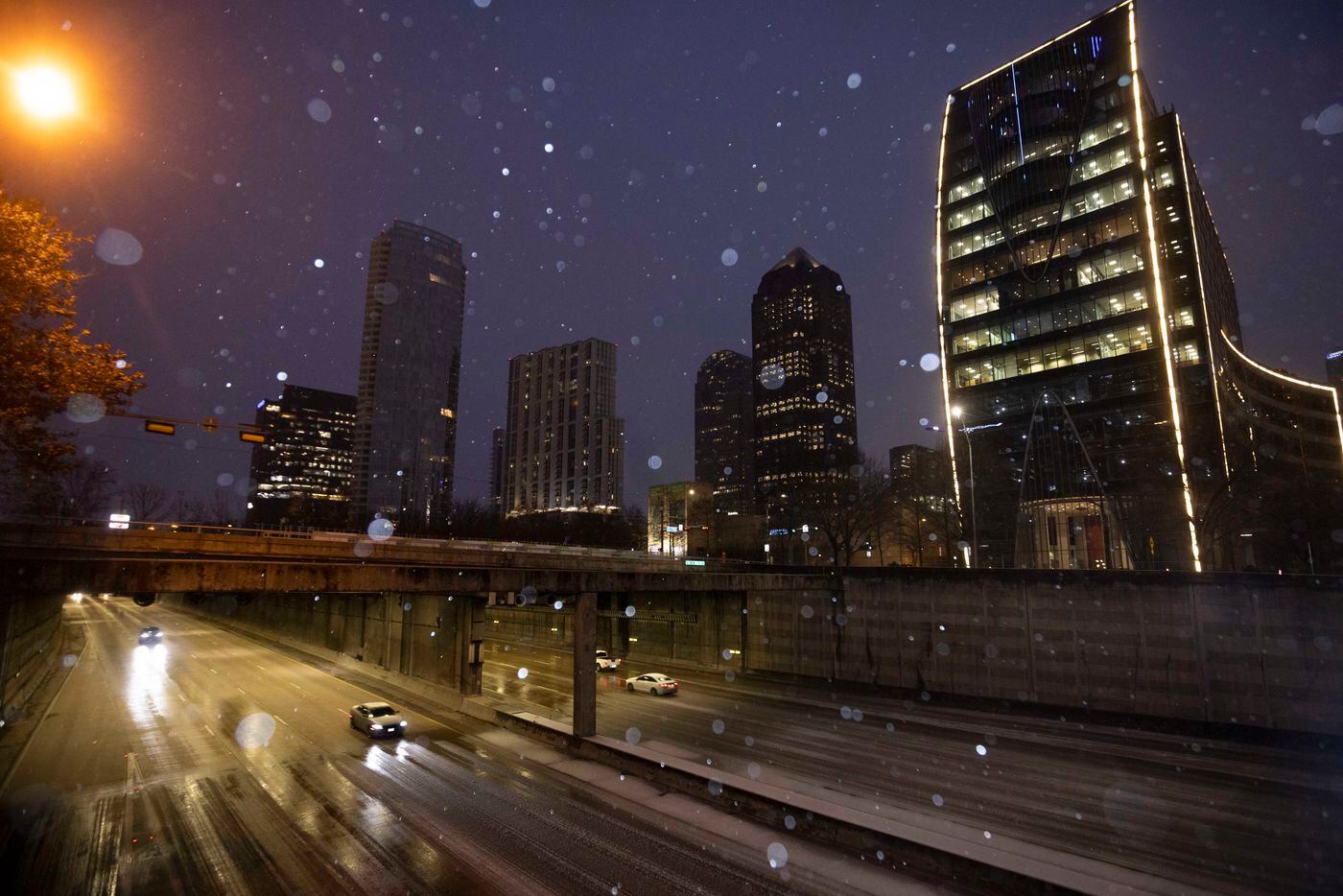 Cars driving along Woodall Rodgers Freeway had sleet to contend with Feb. 3, 2022, in...
