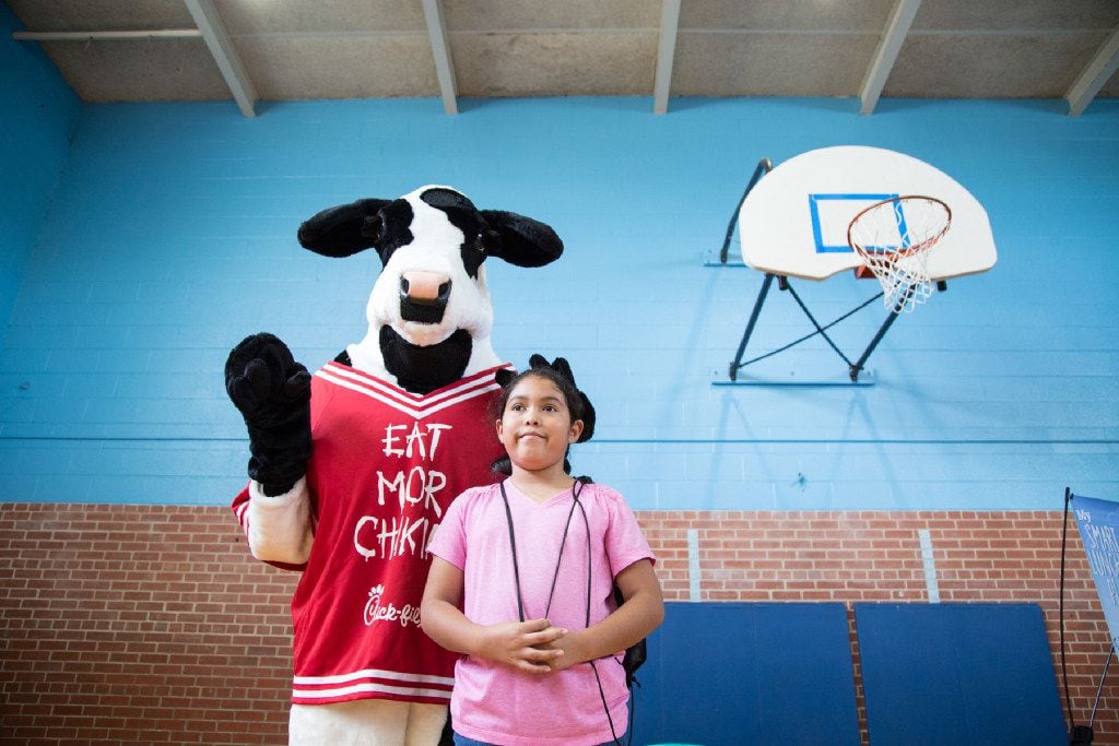 (PHOTO TAKEN 6/13/17) Victoria Calva poses with the Chick fil A mascot during The Summer...