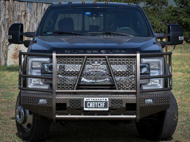 Mike Newton's personal license plate on his Ford truck reads "CWBYCHF" parked out back of...