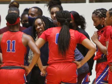 Duncanville Pantherettes head coach LaJeanna Howard speaks with her players during the first...