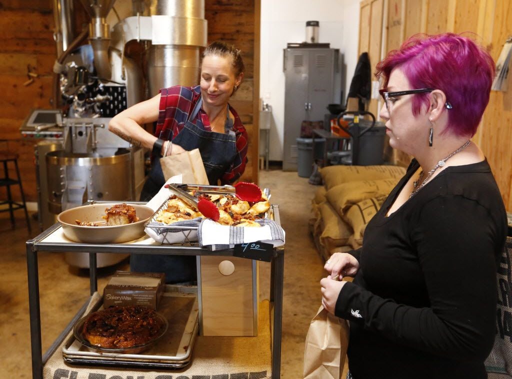 Katherine Clapner, left, fills Misti Zoch's pastry order at Full City Rooster Saturday morning.