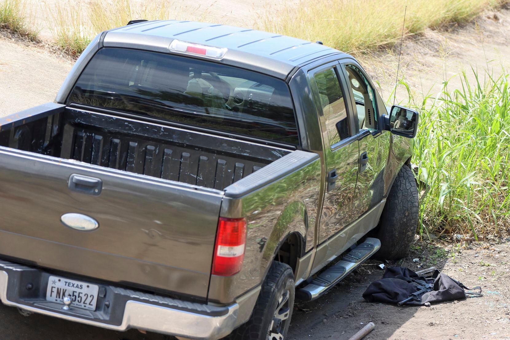 A firearm is seen next to the shooter’s crashed truck near the school in a photo by Pete...