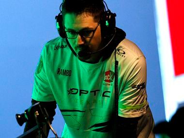 OpTic Texas coach Ray 'Rambo" Luisser communicates with players during a break in the action...