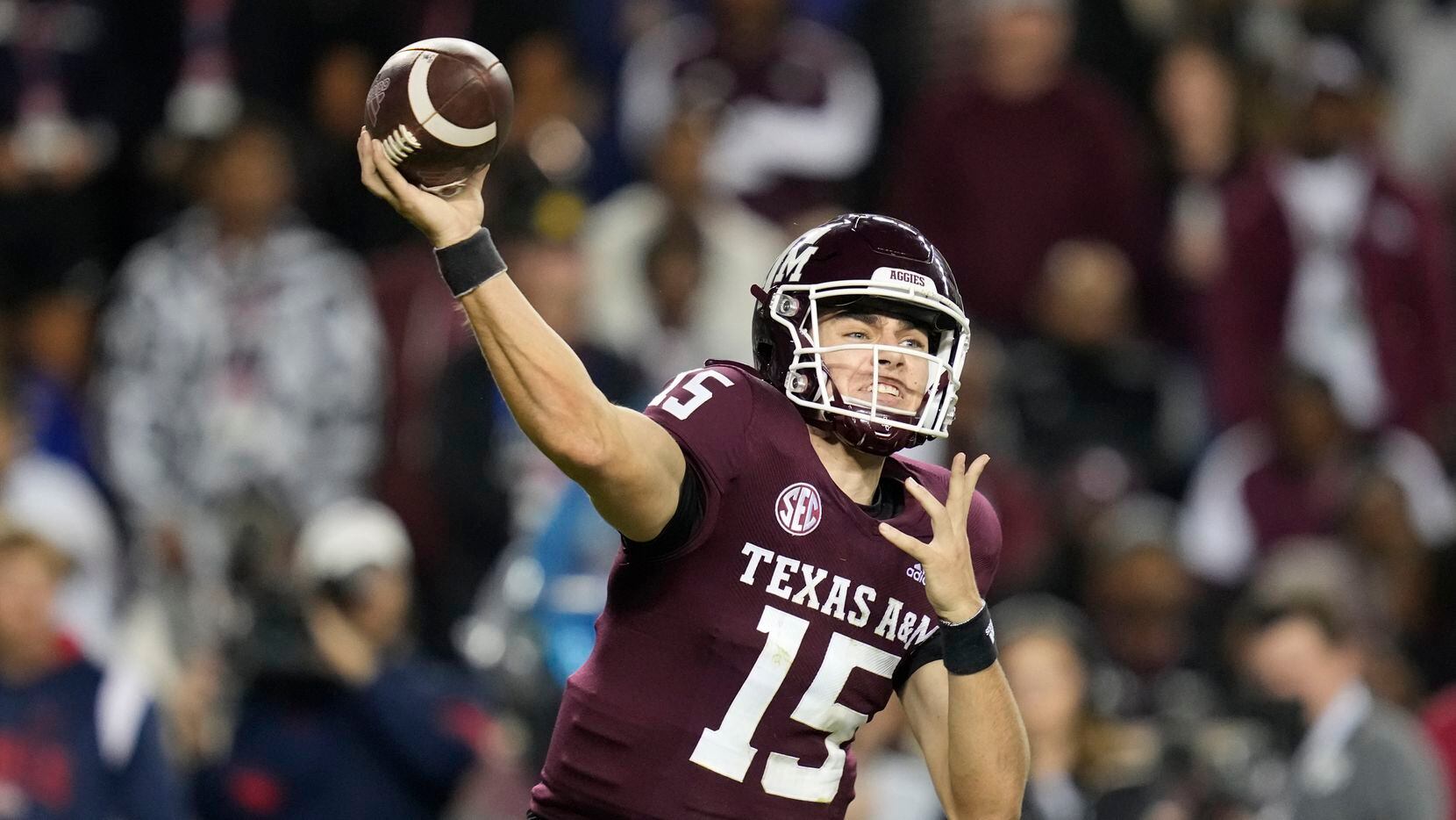 Texas A&M quarterback Conner Weigman (15) throws down field against Mississippi during the...