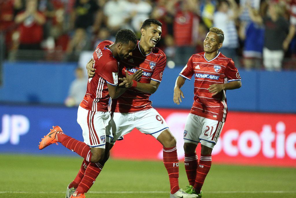 Kellyn Acosta celebrates with teammates during FC Dallas' 4-0 win over Aribe Unido in the...