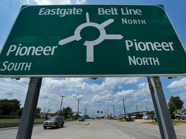 A sign warns drivers in Balch Springs, Texas, that Belt Line Rd merges into a traffic circle...