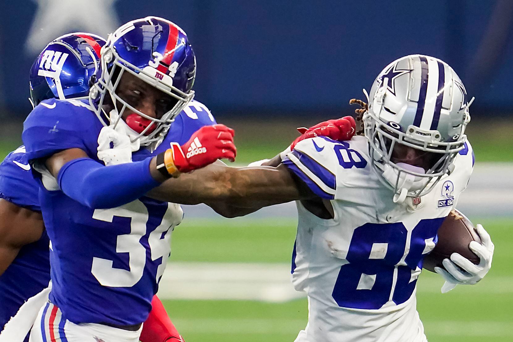 Dallas Cowboys wide receiver CeeDee Lamb (88) pushes past New York Giants safety Adrian Colbert (34) during the second quarter of an NFL football game at AT&T Stadium on Sunday, Oct. 11, 2020, in Arlington. (Smiley N. Pool/The Dallas Morning News)
