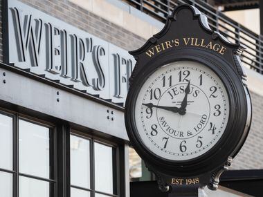 A restored clock from the old Weir's Furniture store is on display outside the new store on...