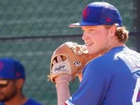 Texas Rangers minor league pitcher T.K. Roby throws a ball in the bullpen during a spring...
