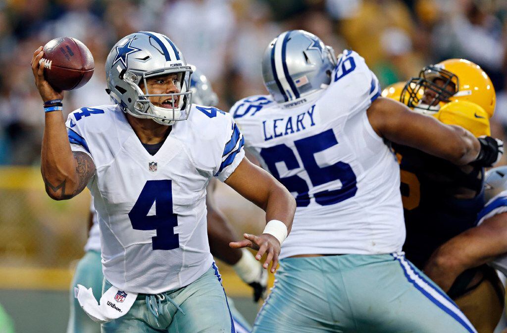 Dallas Cowboys quarterback Dak Prescott (4) looks to pass under pressure during the second...