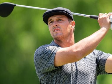 Bryson DeChambeau watches his tee shot on the third hole during the first round of the Wells Fargo Championship golf tournament at Quail Hollow Club on Thursday, May 6, 2021, in Charlotte, N.C. (AP Photo/Jacob Kupferman)
