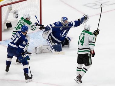 Joe Pavelski (16) and Jamie Benn (14) of the Dallas Stars attack the net as goaltender Andrei Vasilevskiy (88) of the Tampa Bay Lightning makes a save during Game Two of the Stanley Cup Final at Rogers Place in Edmonton, Alberta, Canada on Monday, September 21, 2020.