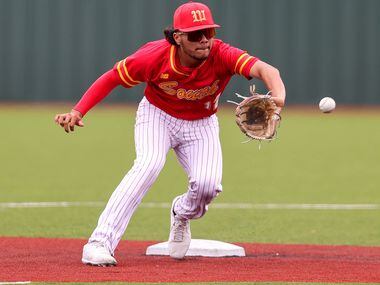 South Grand Prairie second baseman Adrian Najar tries to come up with a groundball  against...